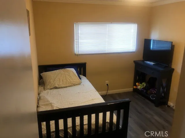 16600 Downey, Unit 115 Paramount, CA 90723 - Photo 9 of 15 a bedroom with a bed and a fireplace