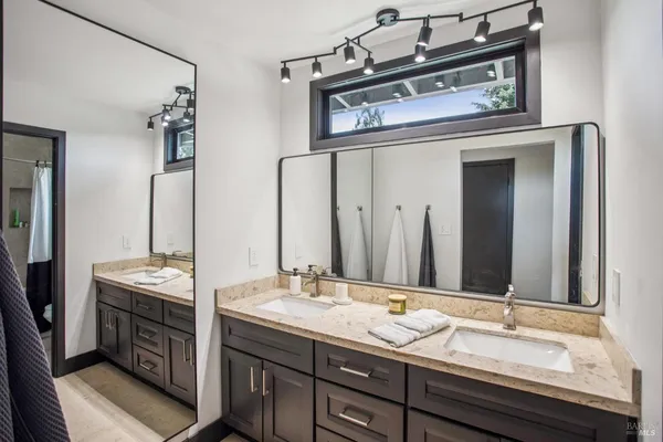 a view of a house with swimming pool and sitting area