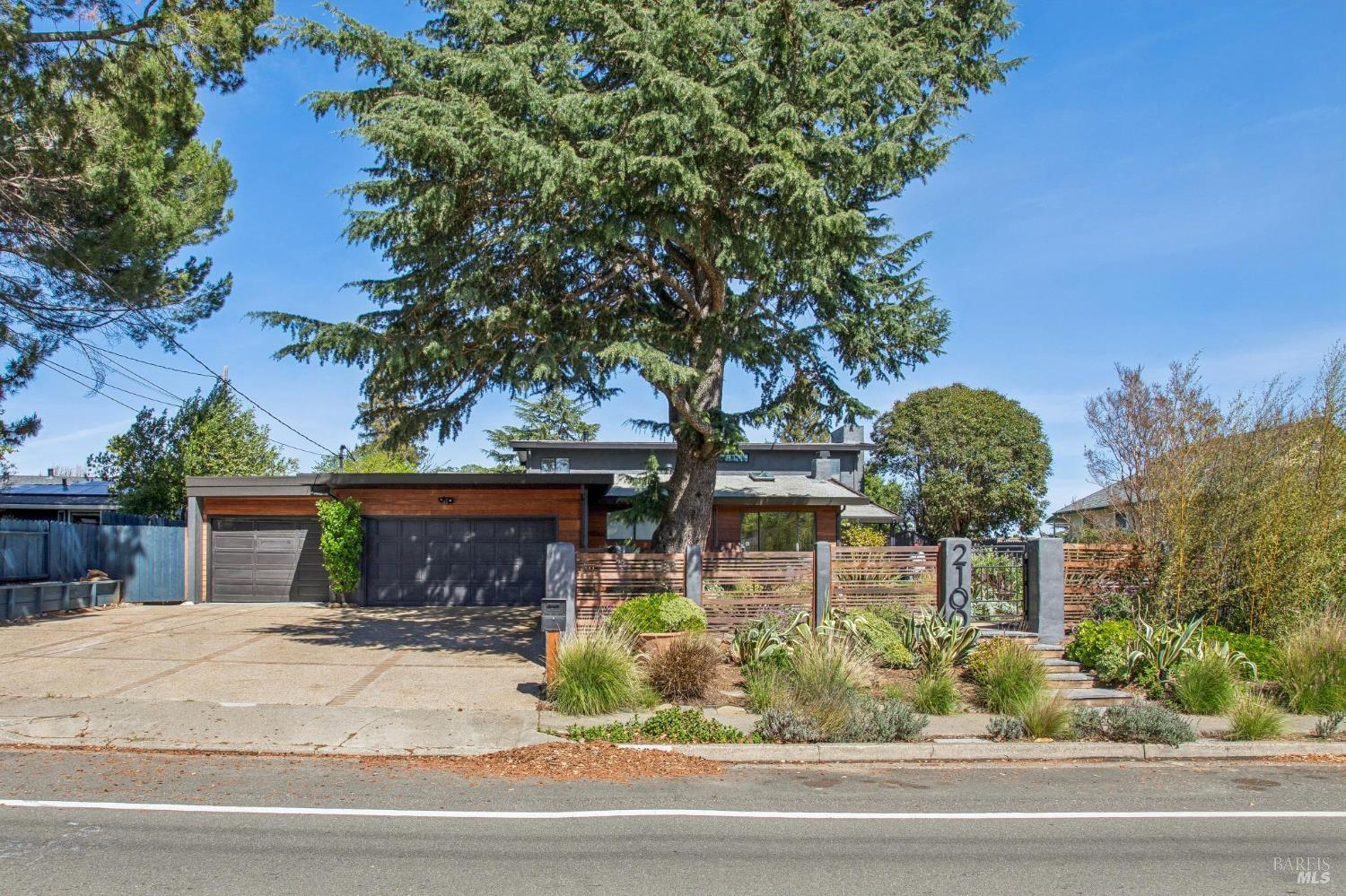 2100 Center Road Novato, CA 94947 - Photo 6 of 32 There are two garages. The one to the right is a two car side by side garage. The one to the left can park two car tandem. This owner uses it a a workshop. Workshop has hot and cold water and 220 wiring. See diagram for approximate dimensions. Off street parking for 6 cars or 4 and a RV.