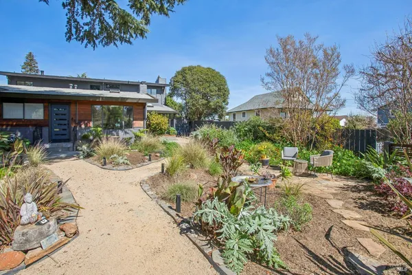 a swimming pool with outdoor seating and yard