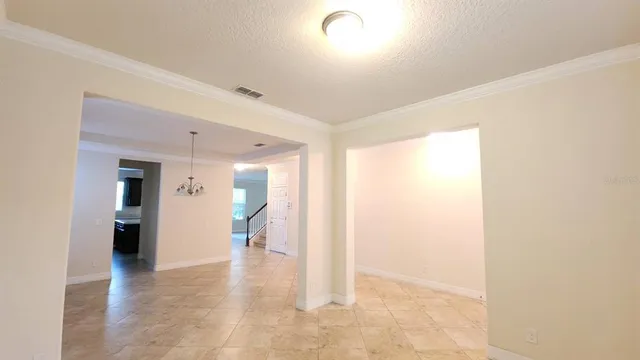 a view of a hallway with wooden shelves