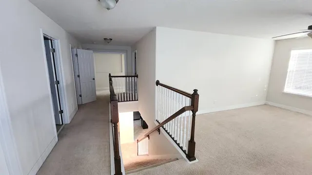 a view of a hallway with windows