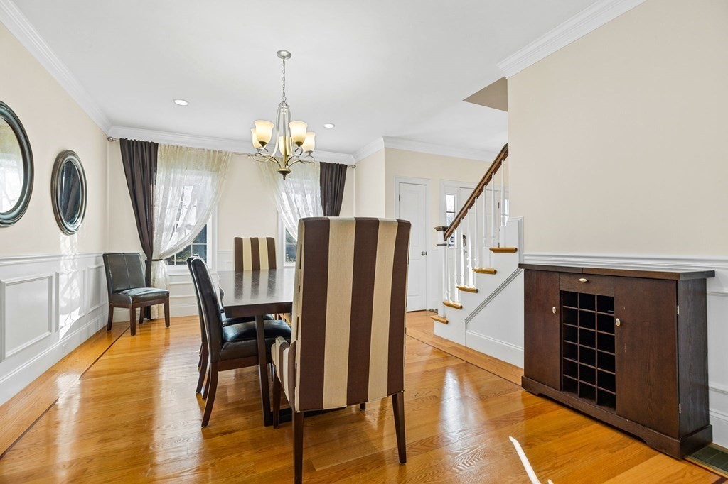 2050 Washington Street Canton, MA 02021 - Photo 13 of 35 a dining room with furniture entryway and wooden floor