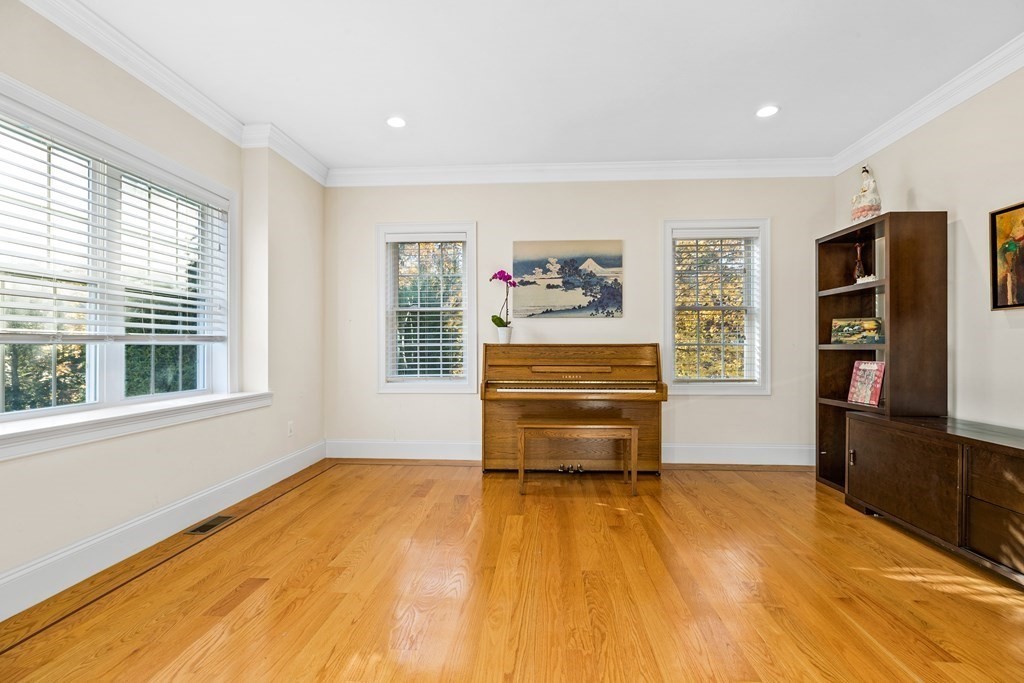 2050 Washington Street Canton, MA 02021 - Photo 14 of 35 a room with a bed and a tv