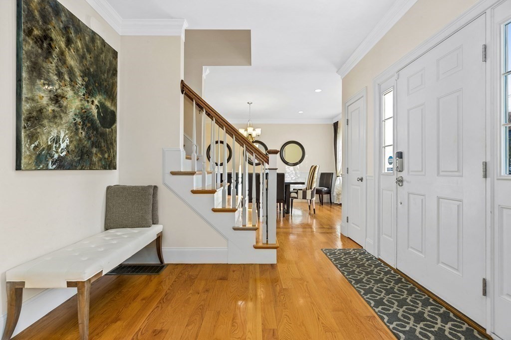2050 Washington Street Canton, MA 02021 - Photo 17 of 35 a view of entryway and hall with wooden floor