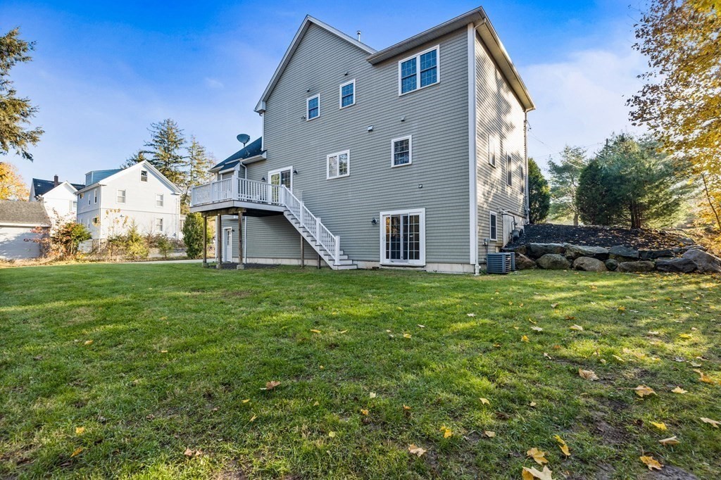 2050 Washington Street Canton, MA 02021 - Photo 31 of 35 a front view of a house with a garden