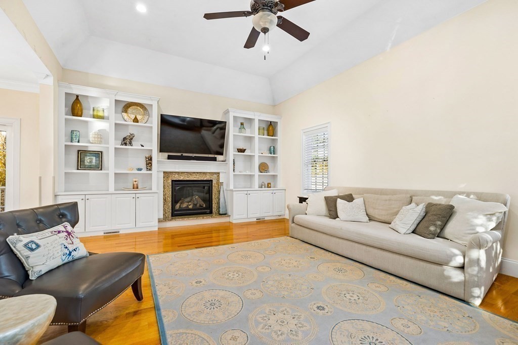 2050 Washington Street Canton, MA 02021 - Photo 7 of 35 a living room with furniture fireplace and flat screen tv
