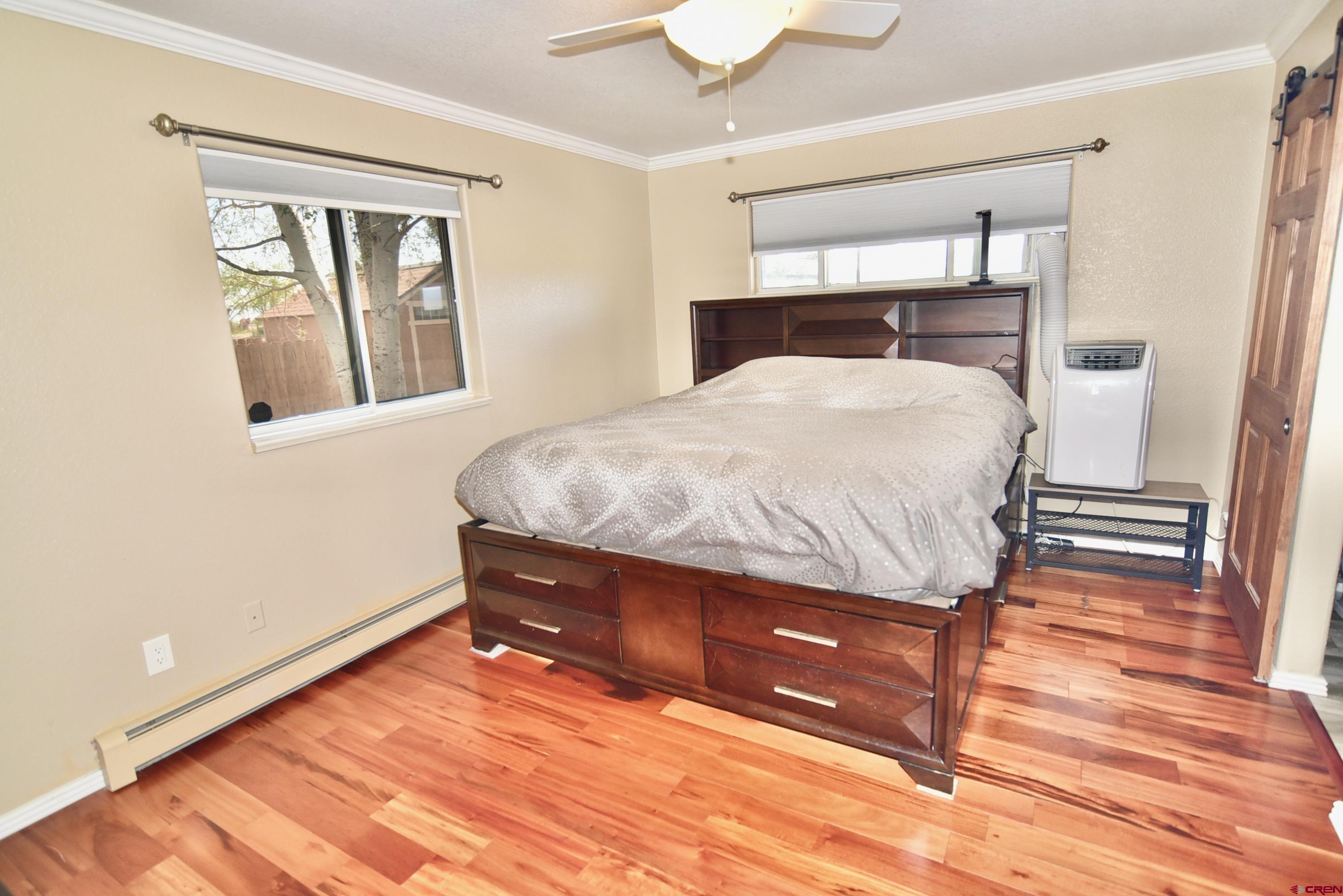 61460 Epitaph Road Montrose, CO 81403 - Photo 16 of 45 a bedroom with a bed and window