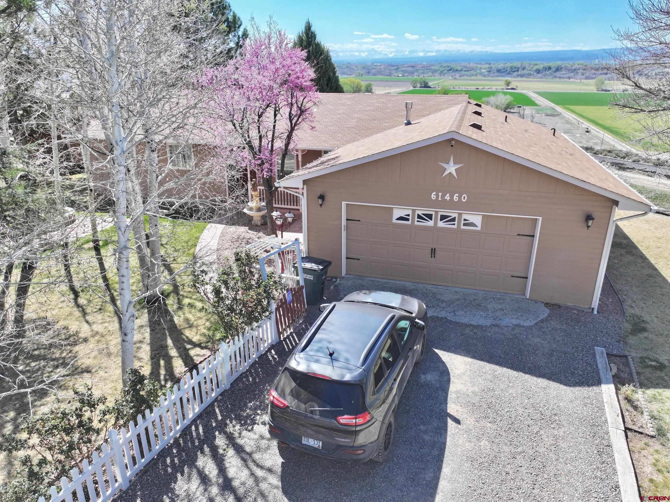61460 Epitaph Road Montrose, CO 81403 - Photo 2 of 45 an aerial view of a house with a yard