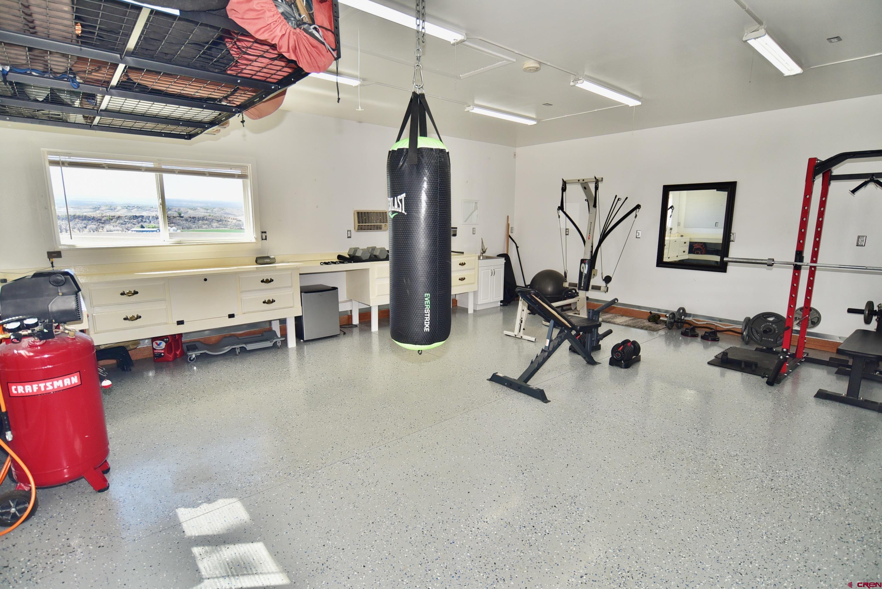 61460 Epitaph Road Montrose, CO 81403 - Photo 27 of 45 a view of a room with gym equipment