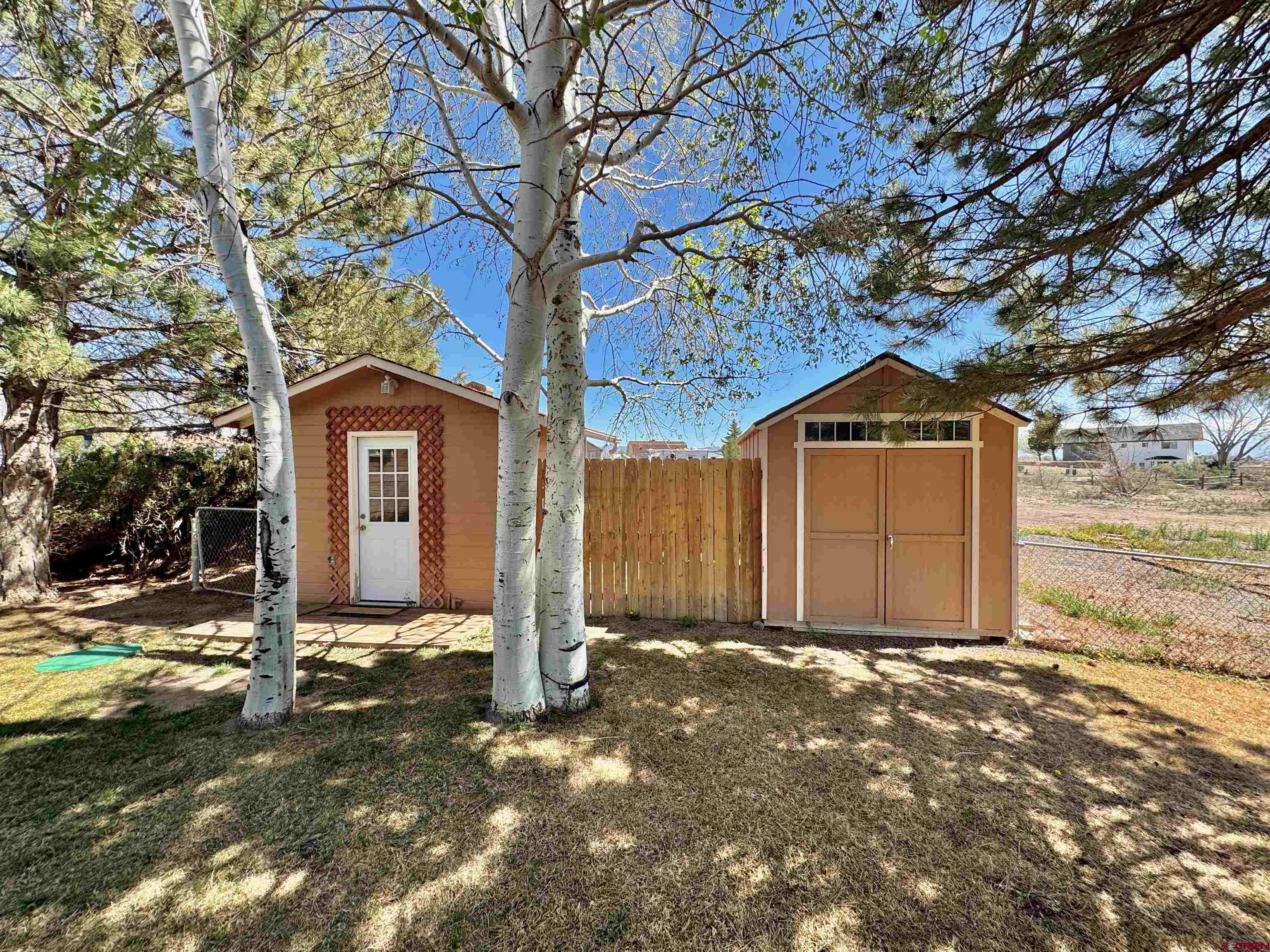 61460 Epitaph Road Montrose, CO 81403 - Photo 31 of 45 a front view of a house with a yard