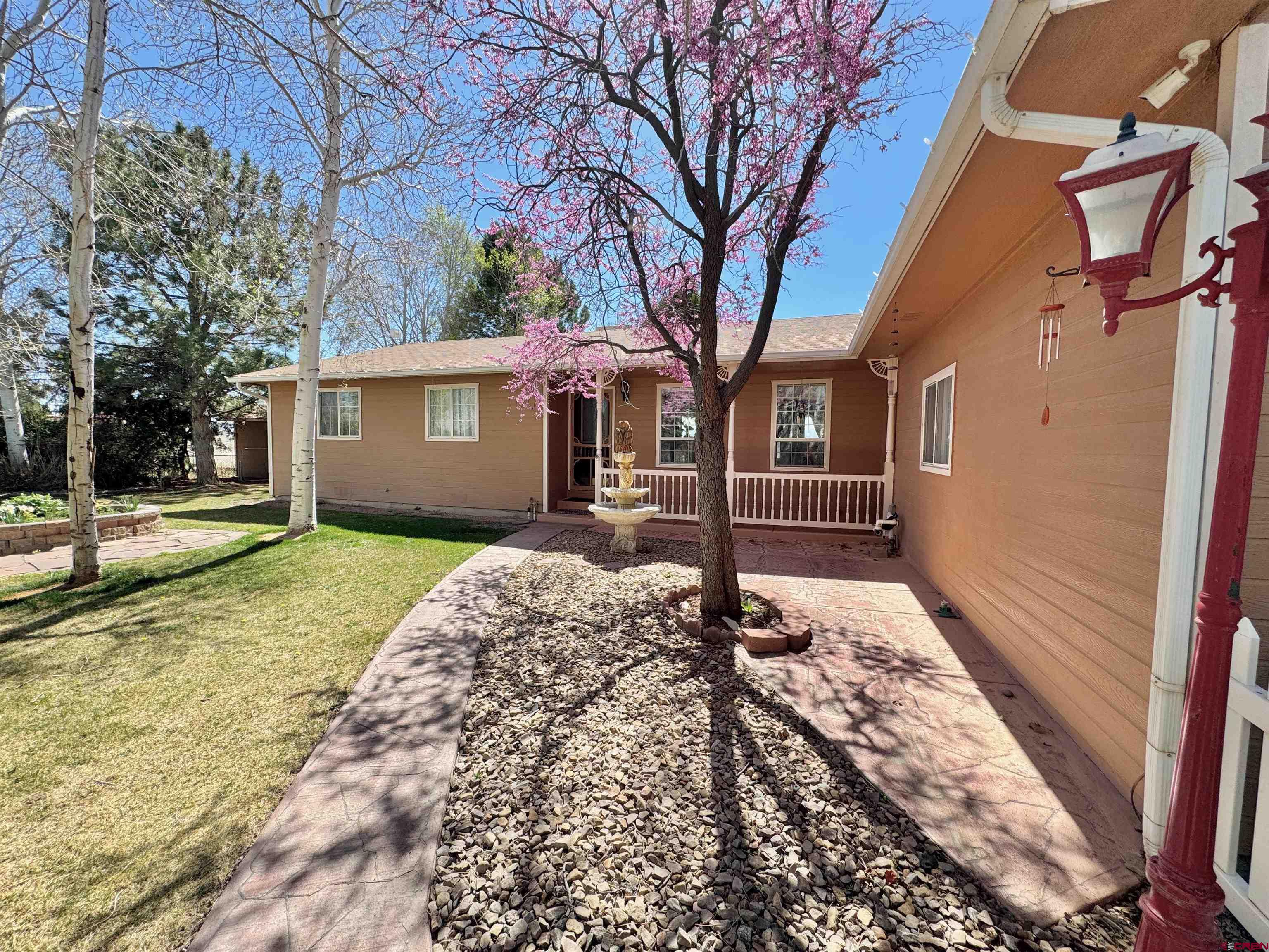 61460 Epitaph Road Montrose, CO 81403 - Photo 34 of 45 a house with trees in front of it
