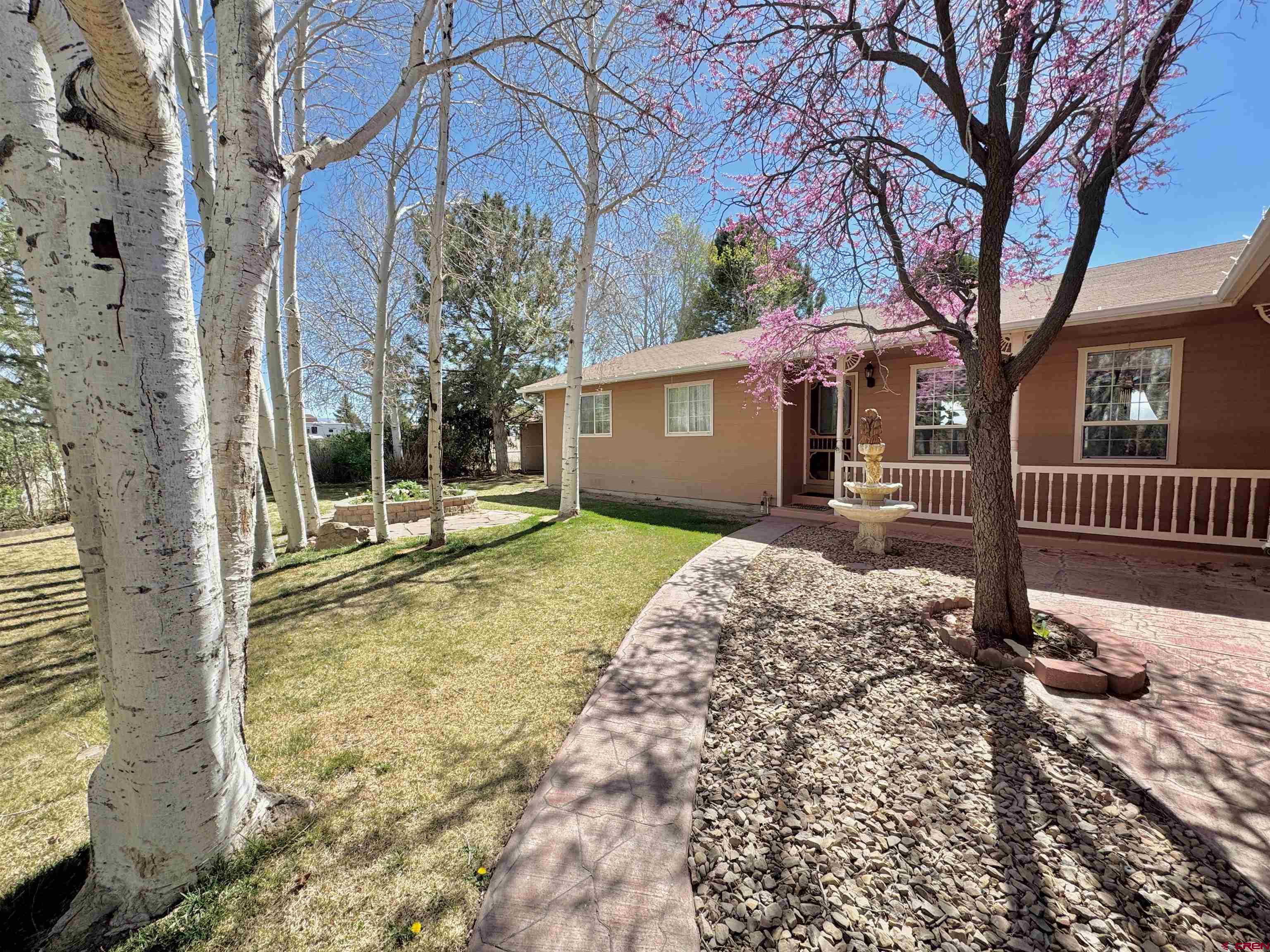 61460 Epitaph Road Montrose, CO 81403 - Photo 36 of 45 a front view of a house with a yard covered with snow