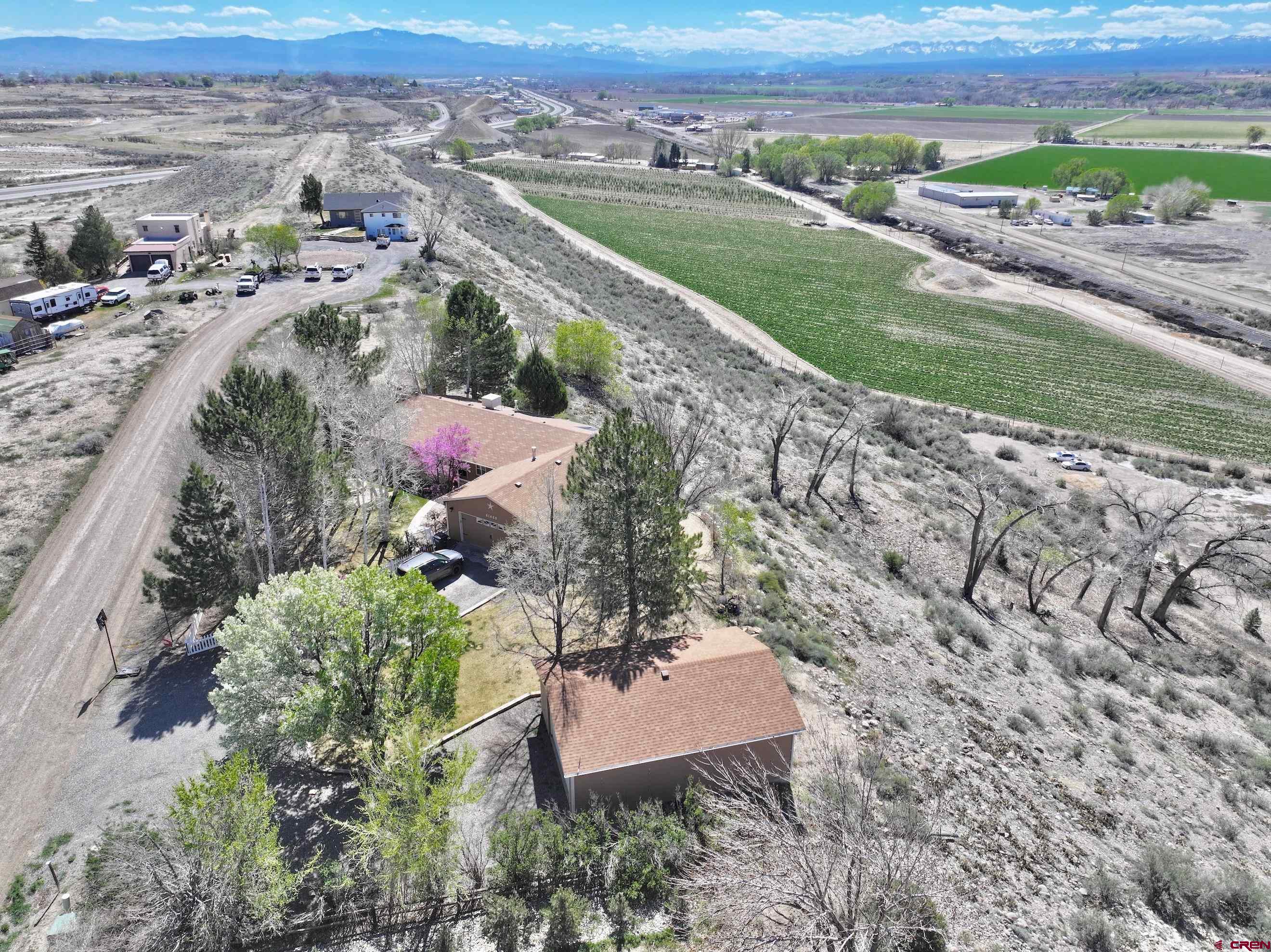 61460 Epitaph Road Montrose, CO 81403 - Photo 37 of 45 an aerial view of a house with a yard
