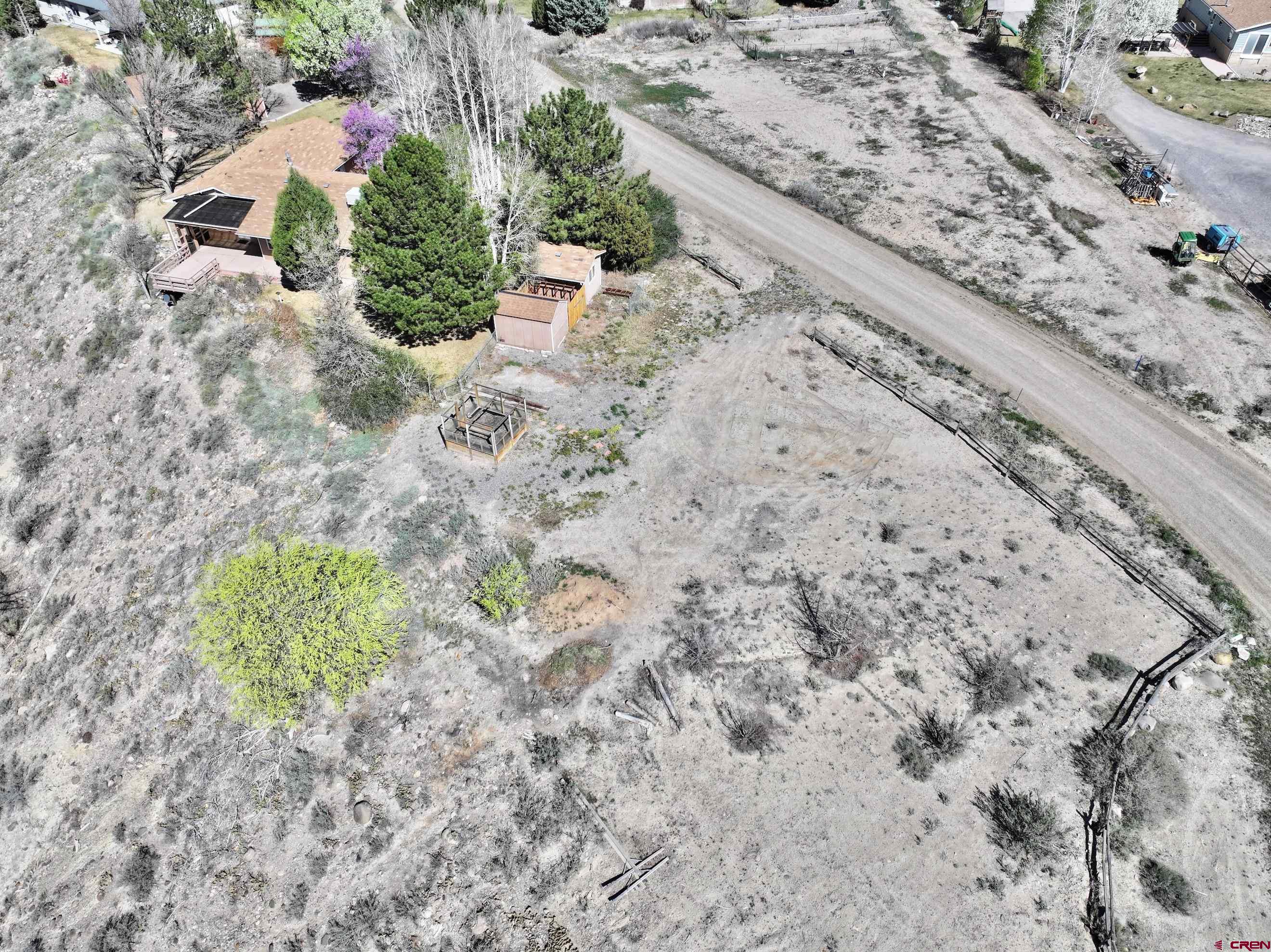 61460 Epitaph Road Montrose, CO 81403 - Photo 41 of 45 a view of a dry yard with wooden fence
