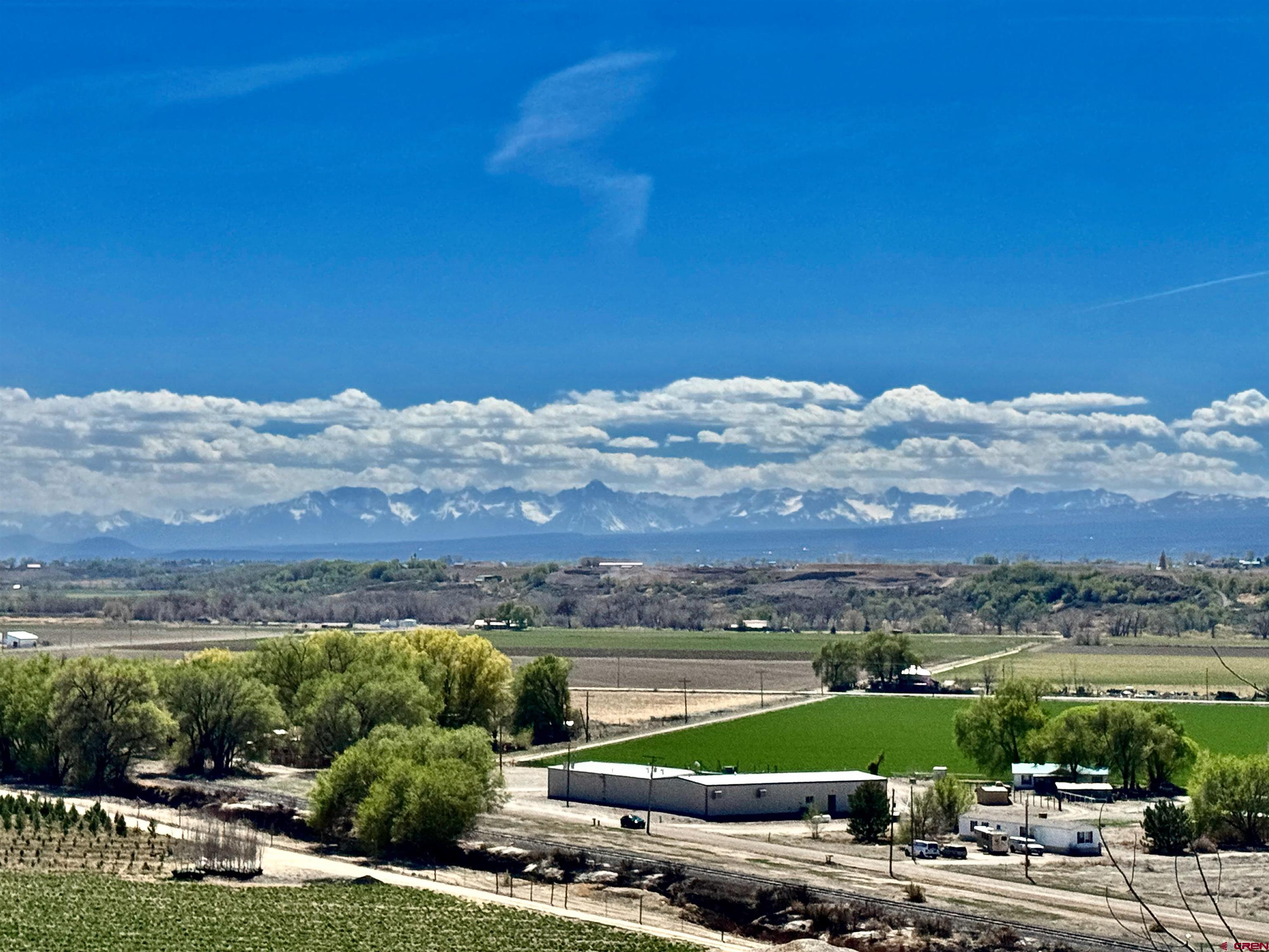 61460 Epitaph Road Montrose, CO 81403 - Photo 5 of 45 a view of a lake with a mountain in the background