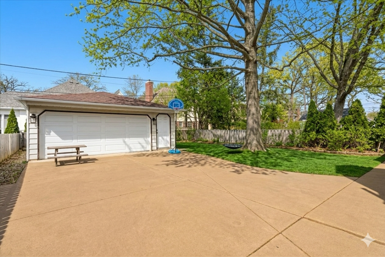 1104 South Lincoln Avenue Park Ridge, IL 60068 - Photo 29 of 37 a view of a house with a yard and garage