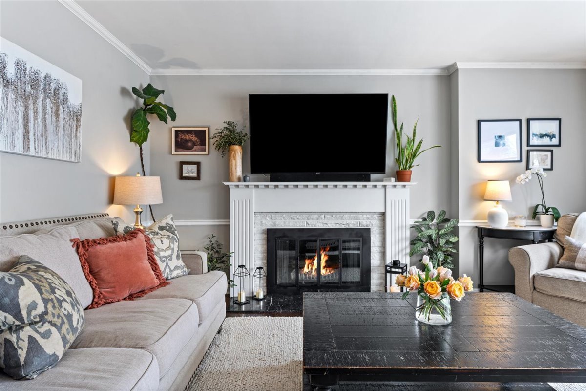 1104 South Lincoln Avenue Park Ridge, IL 60068 - Photo 4 of 37 a living room with furniture a fireplace and a flat screen tv