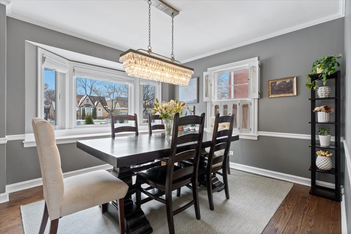 1104 South Lincoln Avenue Park Ridge, IL 60068 - Photo 8 of 37 a dining room with furniture a chandelier and wooden floor