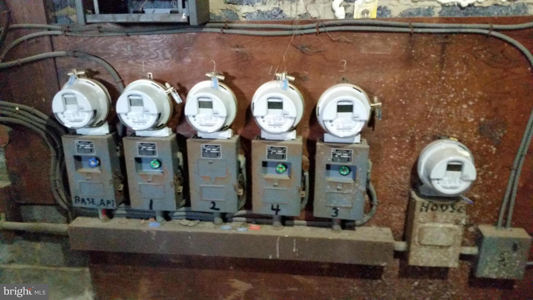 77 Forrester Street Southwest Washington, DC 20032 - Photo 14 of 22 a bathroom with a mirror and a clock on the wall