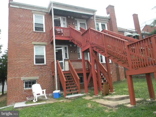 77 Forrester Street Southwest Washington, DC 20032 - Photo 20 of 22 a front view of a house with a yard