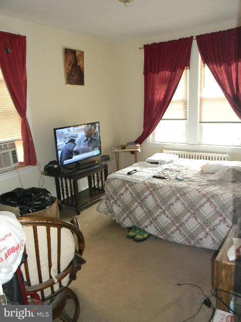 77 Forrester Street Southwest Washington, DC 20032 - Photo 8 of 22 a bedroom with bed and a window