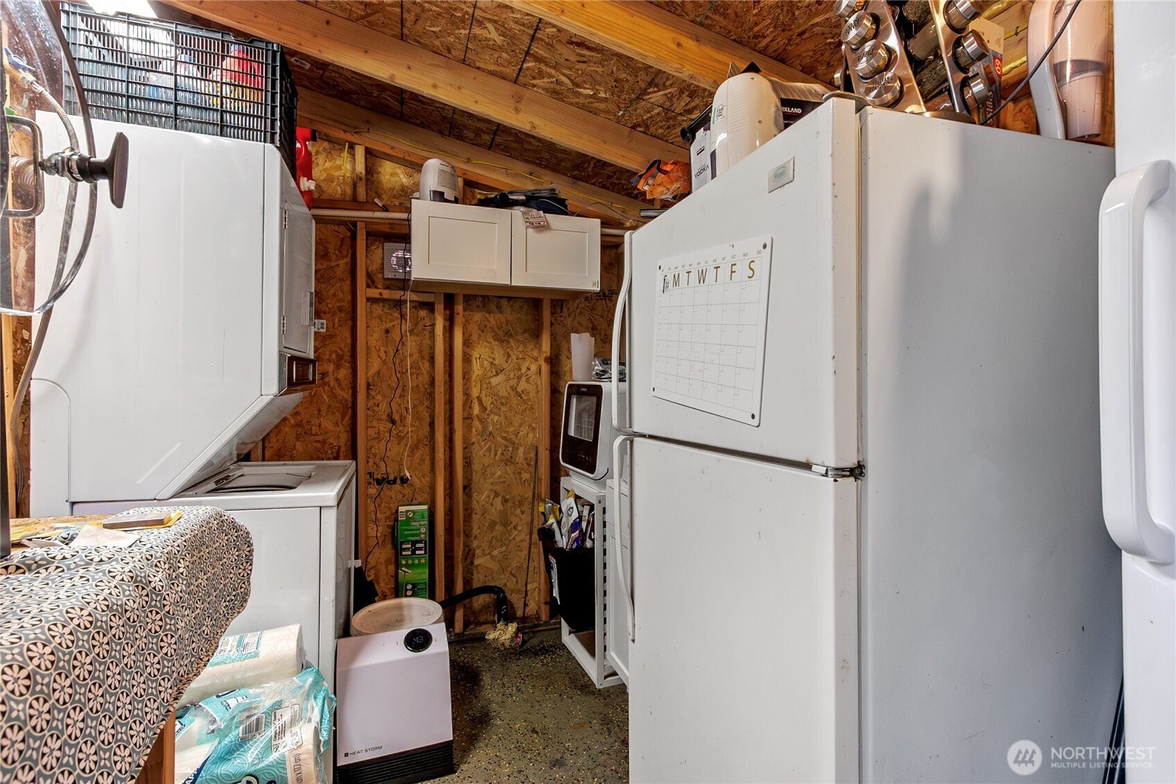 17124 80th Street Southwest Longbranch, WA 98351 - Photo 17 of 37 a view of walk in closet with clothes and shoes