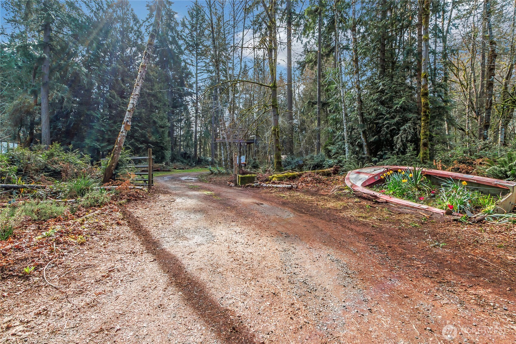 17124 80th Street Southwest Longbranch, WA 98351 - Photo 3 of 37 a backyard of a house with lots of green space and fountain