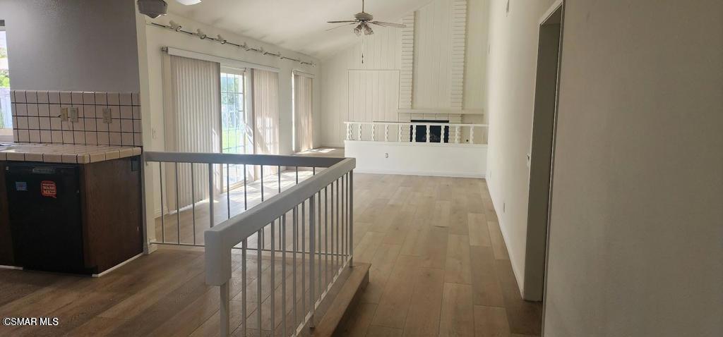 319 Bethany Street Thousand Oaks, CA 91360 - Photo 6 of 9 a view of staircase with lots of frames on wall and a window