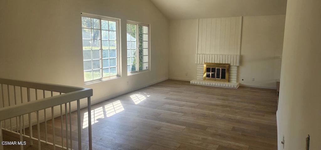 319 Bethany Street Thousand Oaks, CA 91360 - Photo 7 of 9 a view of a hallway with wooden floor and a kitchen