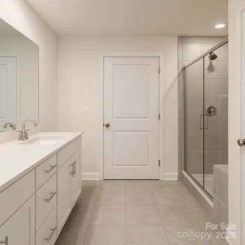 a spacious bathroom with a shower and a sink