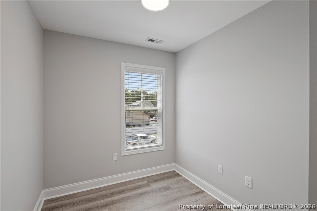 134 Huzzas Circle Cameron, NC 28326 - Photo 22 of 31 a view of room with window and hardwood floor