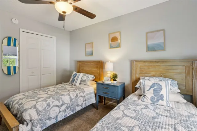 a bathroom with a glass shower door and a sink