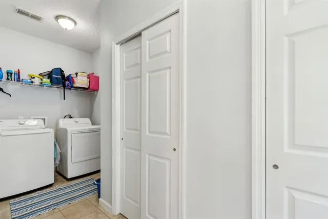 a kitchen with counter top space cabinets and appliances