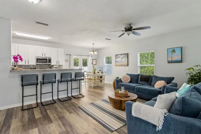 a living room with furniture and a rug