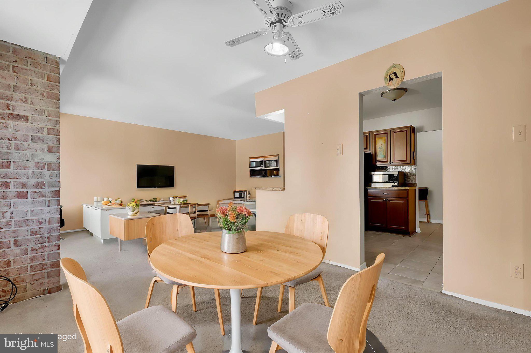 19309 Club House Road, Unit 19309 Gaithersburg, MD 20886 - Photo 7 of 24 a view of a dining room with furniture