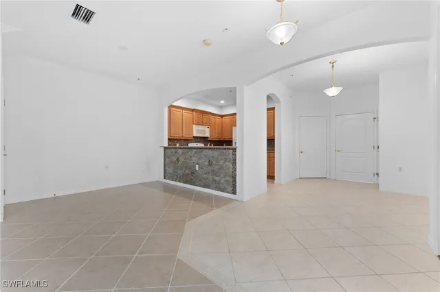 a bathroom with a double vanity sink mirror and shower