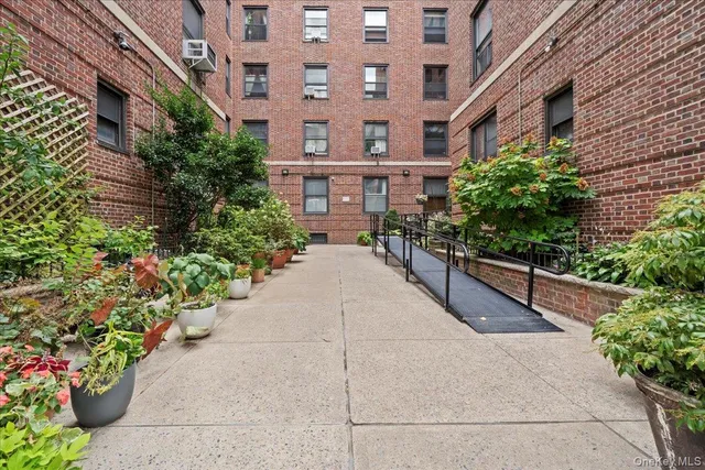 a view of a building with potted plants