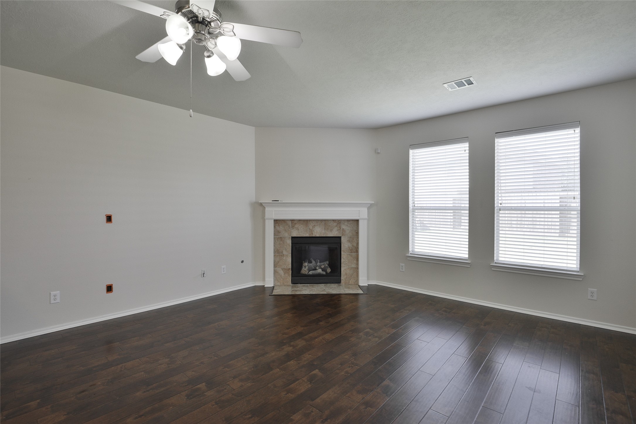 3618 Orchard Valley Lane Spring, TX 77386 - Photo 16 of 39 an empty room with wooden floor chandelier and windows