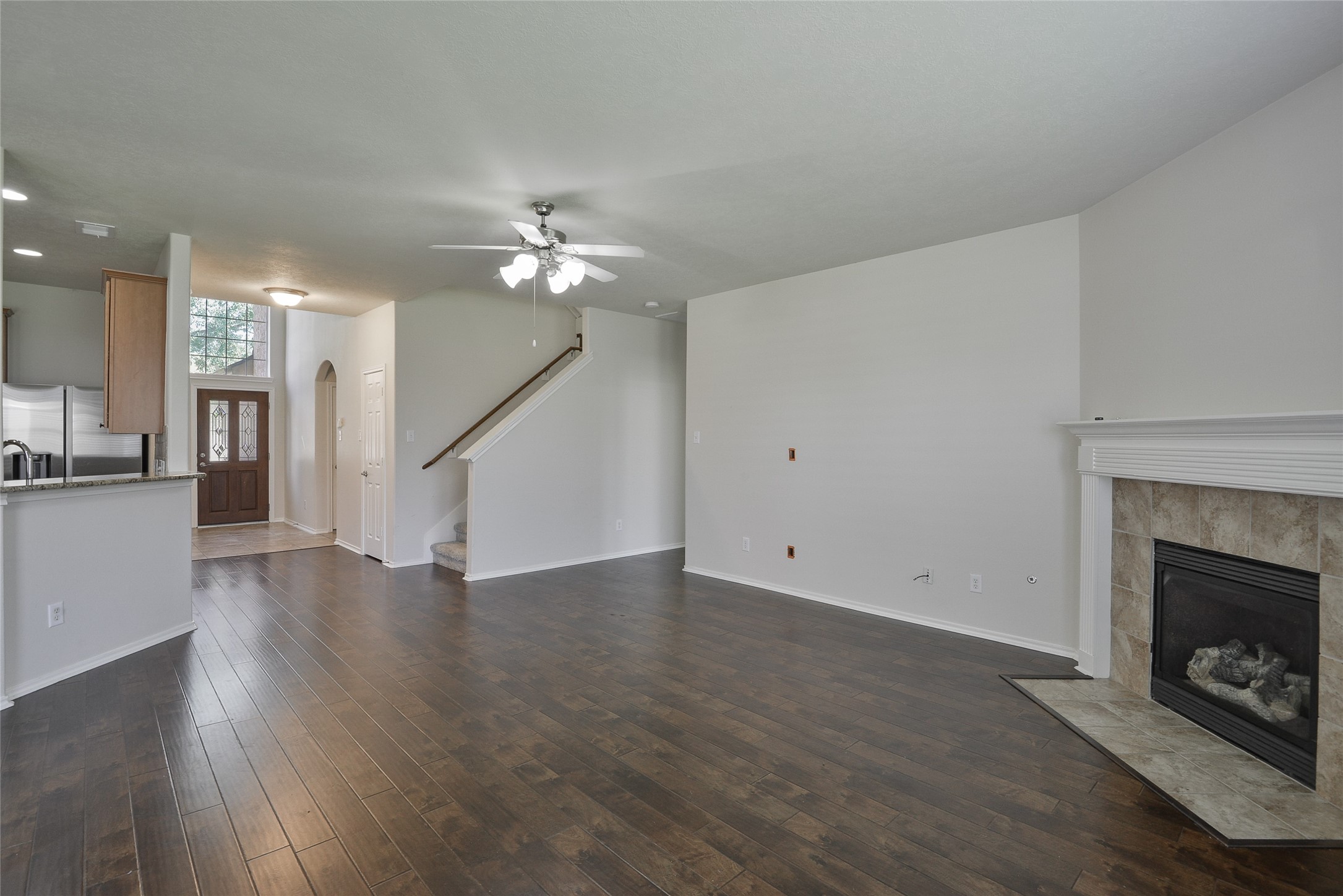 3618 Orchard Valley Lane Spring, TX 77386 - Photo 17 of 39 a view of an empty room with wooden floor fireplace and a window