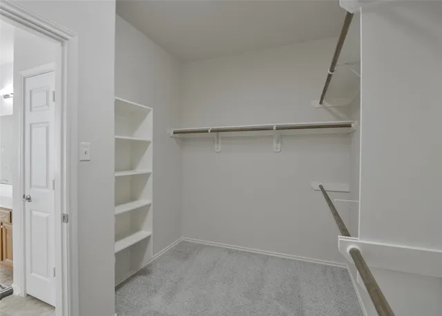 a view of an empty walk in closet