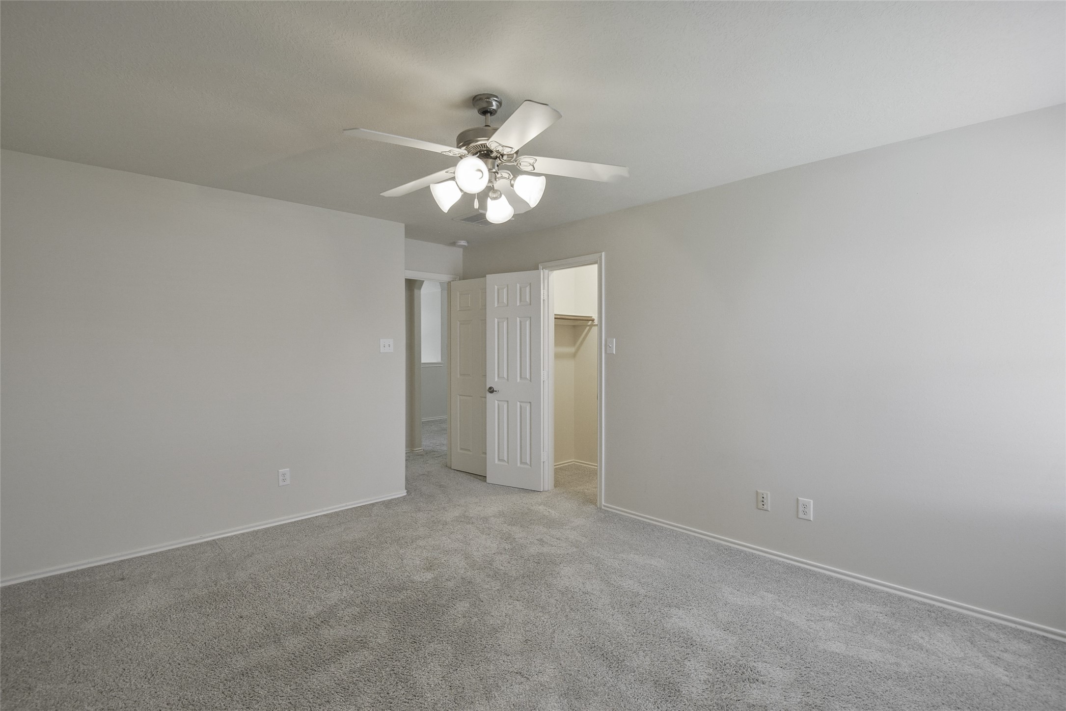 3618 Orchard Valley Lane Spring, TX 77386 - Photo 28 of 39 an empty room with a light and a fan