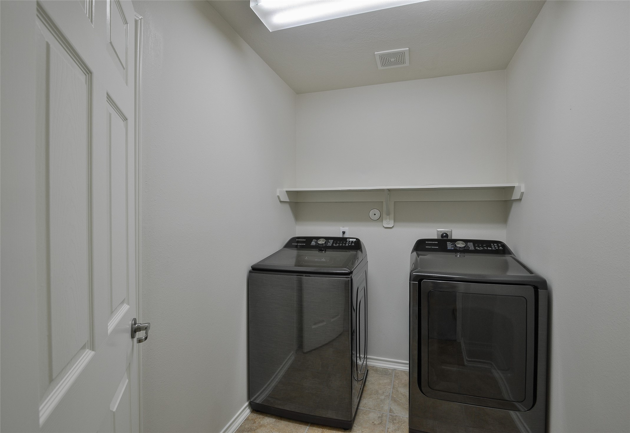 3618 Orchard Valley Lane Spring, TX 77386 - Photo 33 of 39 a utility room with dryer and washer