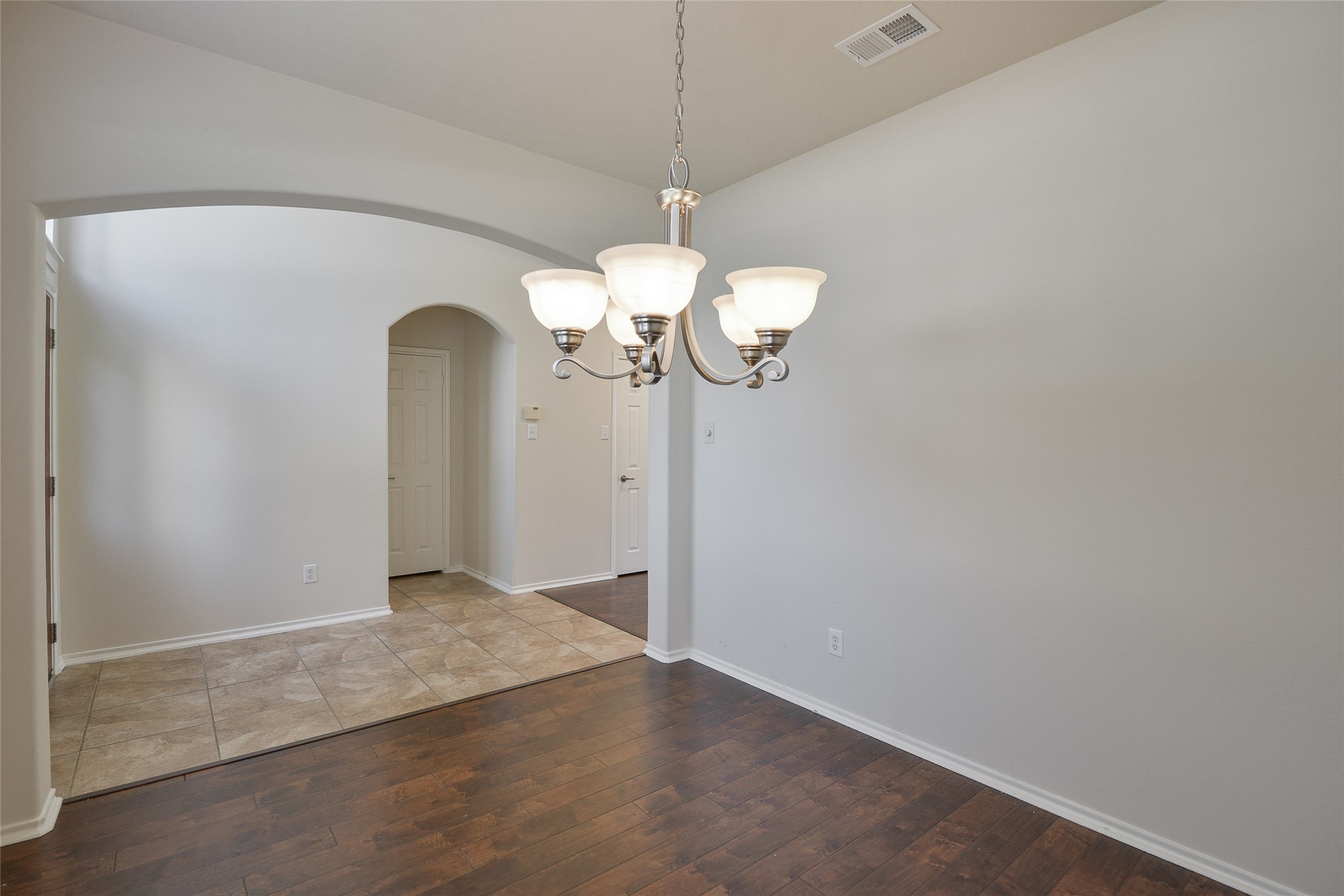 3618 Orchard Valley Lane Spring, TX 77386 - Photo 7 of 39 a view of a chandelier fan and wooden floor