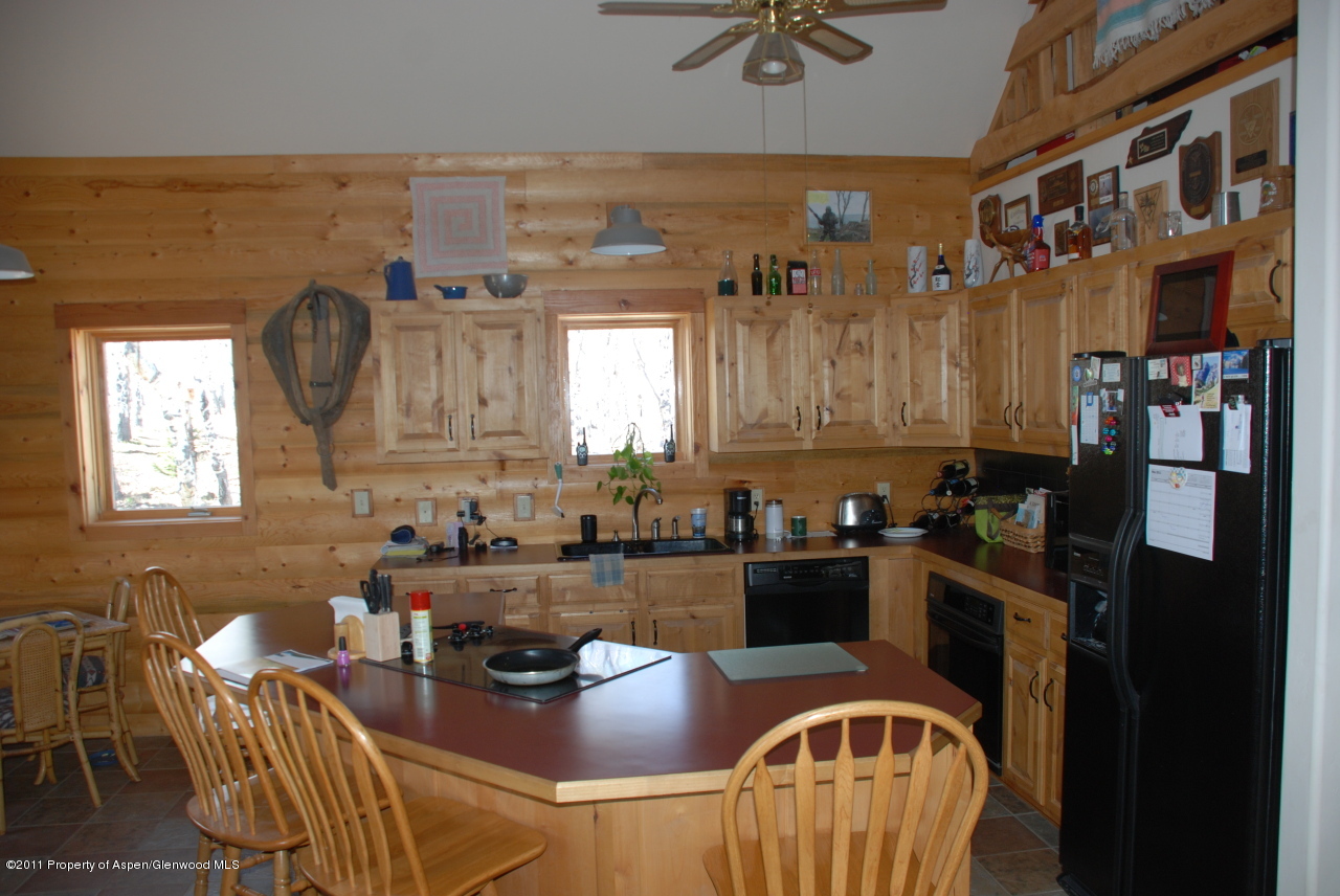 630 Foster Ridge Road Glenwood Springs, CO 81601 - Photo 15 of 27 a kitchen with stainless steel appliances granite countertop a sink and cabinets