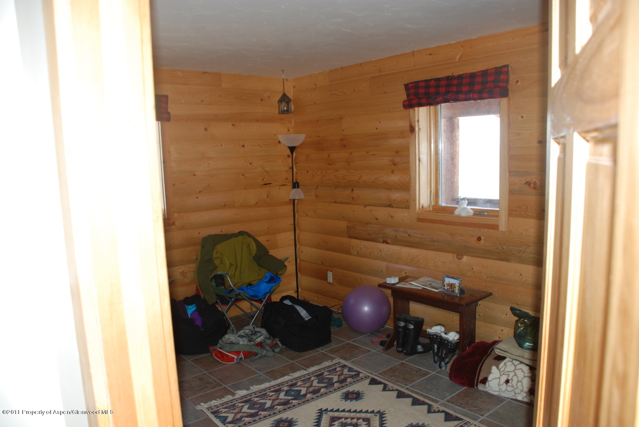 630 Foster Ridge Road Glenwood Springs, CO 81601 - Photo 17 of 27 a room with a couch and a window