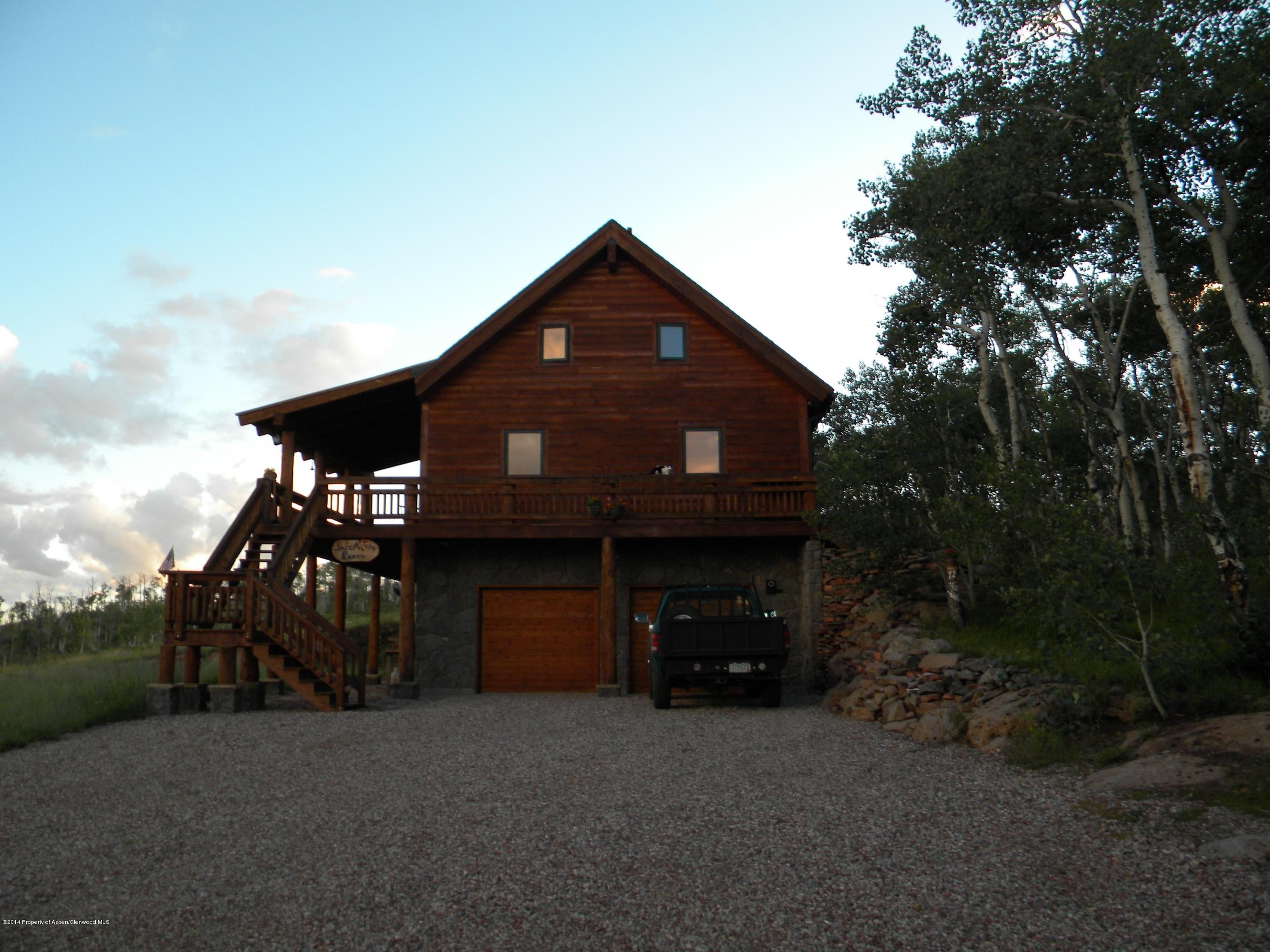 630 Foster Ridge Road Glenwood Springs, CO 81601 - Photo 2 of 27 a front view of a house with yard and seating space
