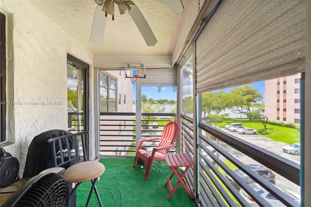 a room with furniture and a large window