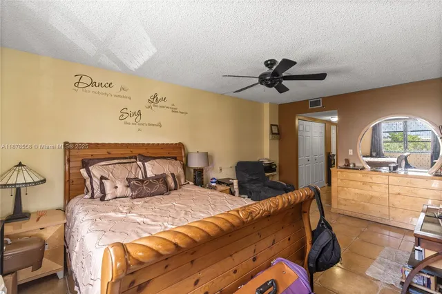 a bed room with two bed and a chandelier