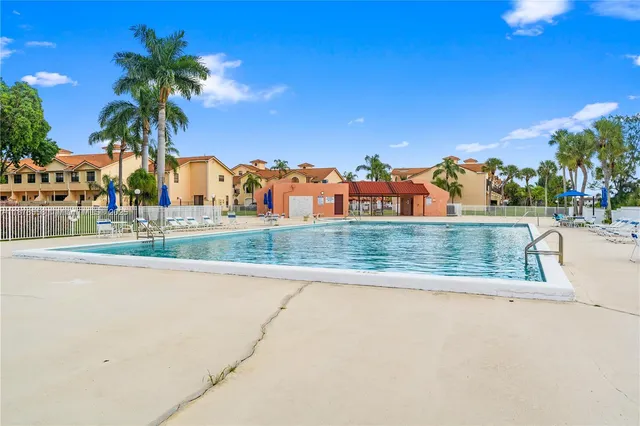 a view of a yard with palm trees
